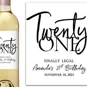 May include: White wine bottle with a black and white label that says "Twenty One" and "Finally Legal Amanda's 21st Birthday November 16, 2021".