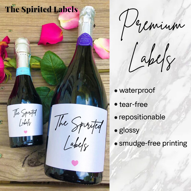 May include: Two bottles of sparkling wine with white labels that say "The Spirited Labels" with a pink heart. The labels are waterproof, tear-free, repositionable, glossy, and smudge-free.