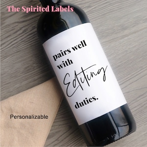 May include: A white wine bottle label with black text that reads "pairs well with Editing duties."