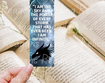May include: A bookmark with a blue background featuring lightning and the text "I AM THE SKY AND THE POWER OF EVERY STORM THAT HAS EVER BEEN. I AM INFINITE." A black dragon silhouette is at the bottom.