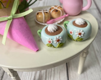 set of 2 floral decorated mugs with 2 hot cross buns