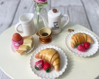 Miniature set of Croissant with strawberries on plate