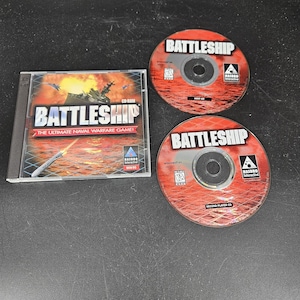 May include: A Battleship CD-ROM game with two CDs and a case. The case features the game's title and a naval warfare scene. The CDs are red with the game's title and logo. The game is for Windows 95.
