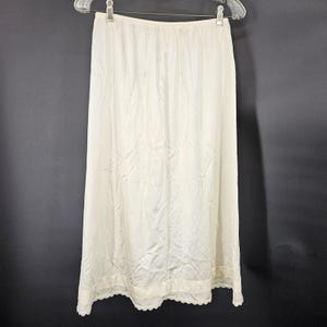 May include: A set of three ceramic mugs with a speckled, matte finish. The mugs are in shades of cream, light gray, and dark gray. Each mug has a simple, minimalist design and a rounded handle.