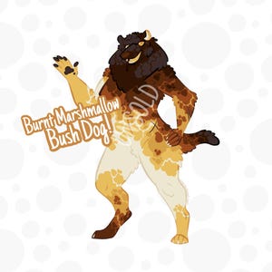 May include: Illustration of a stylized anthropomorphic dog with a lion-like mane. The dog's fur is a mix of brown, tan, and cream colors. Text on the image reads "Burnt Marshmallow Bush Dog!" and "SOLD". The background is white with scattered white circles.