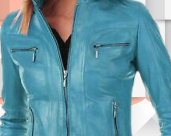 May include: A bright turquoise leather jacket featuring a stand-up collar, a full-length silver front zipper, and two horizontal zippered chest pockets. The jacket includes two additional vertical zippered pockets at the waist and a black belt.