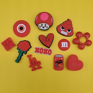 Brand new trending shoe charms for your crocs. Popular croc compatible charms, red shoe charms, heart charms, rose, evil eye charms