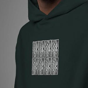 May include: A dark forest green hooded sweatshirt featuring a central graphic design composed of eight rectangular panels arranged in two rows. Each panel contains a detailed white line art pattern of intersecting geometric diamond shapes.