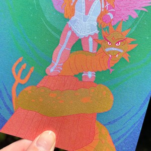 May include: A colorful illustration featuring a figure with wings and armor standing on a serpent-like creature. The artwork uses shades of orange, pink, blue, and green. A trident is visible in the lower left corner. The style is reminiscent of fantasy art.