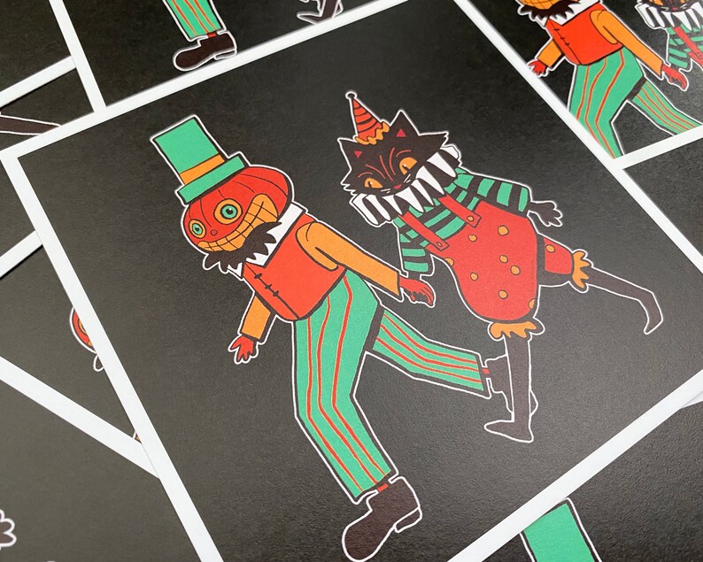 May include: A black and white illustration of a pumpkin and a cat dressed as clowns. The pumpkin is wearing a green hat and a red and white striped shirt. The cat is wearing a red and white striped shirt and a red and white striped hat. The background is black.