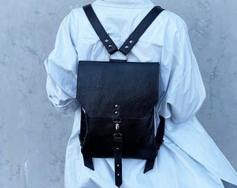 Small women's backpack made of genuine black leather