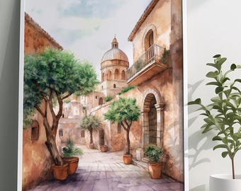 May include: A watercolor painting of a narrow street in a European city. The street is lined with buildings, and there are trees and plants growing along the sides. The buildings are painted in shades of brown and yellow, and the sky is a light blue. The painting is framed in a white frame.