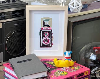 Dessin d'un appareil photo reflex à double objectif (TLR)