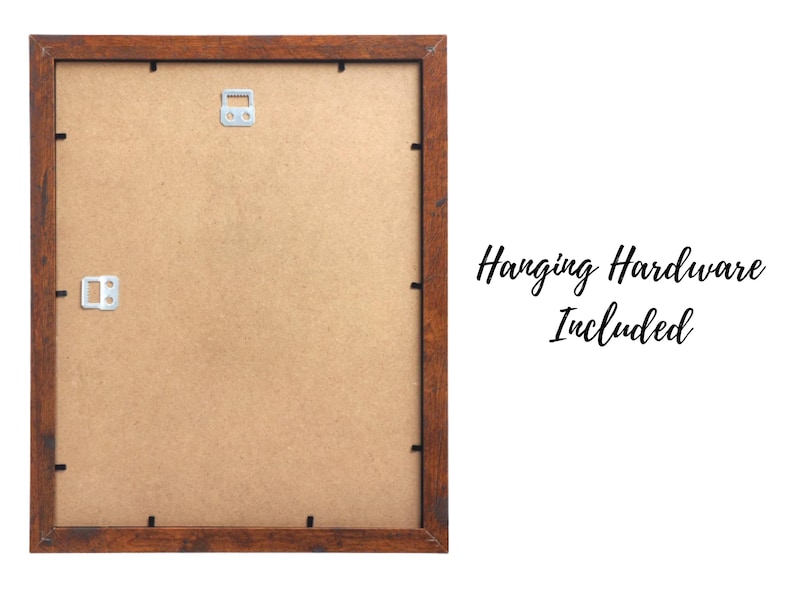 May include: A brown wooden picture frame with a light brown mat. The frame has hanging hardware included.