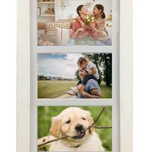 May include: White picture frame with three openings, each holding a different photograph. The top photo shows two people smiling at each other, the middle photo shows a person carrying a child on their shoulders, and the bottom photo shows a golden retriever puppy chewing on a stick.