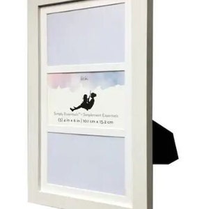 May include: White picture frame with three openings for photos. The top opening is horizontal and the bottom two are vertical. The frame has a white mat and a black stand. The text on the frame reads "Simply Essentials - Sentiment Essentials (3) 4 in x 6 in | 10.1 cm x 15.2 cm"