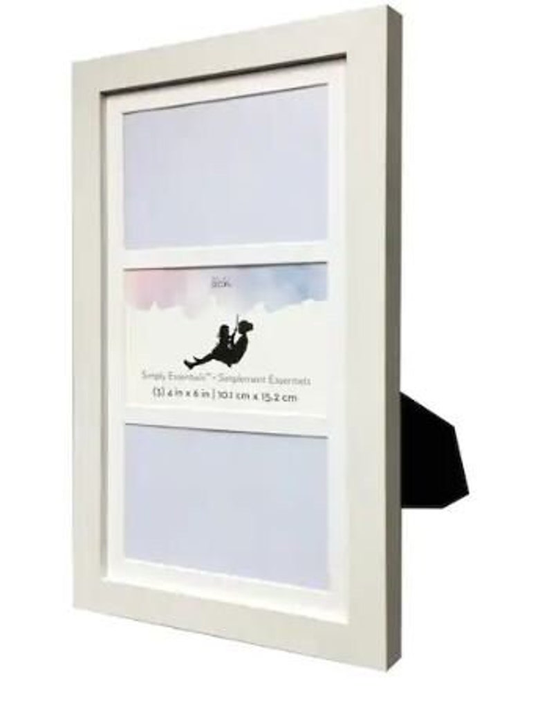 May include: White picture frame with three openings for photos. The top opening is horizontal and the bottom two are vertical. The frame has a white mat and a black stand. The text on the frame reads "Simply Essentials - Sentiment Essentials (3) 4 in x 6 in | 10.1 cm x 15.2 cm"
