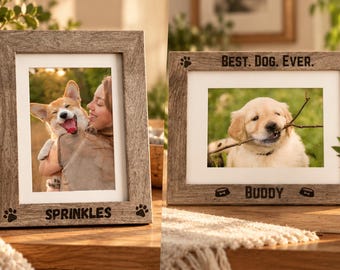 May include: Two rectangular wooden picture frames with a weathered gray finish. The vertical frame features the name SPRINKLES and paw prints. The horizontal frame features the text BEST. DOG. EVER., the name BUDDY, and dog bowl icons.
