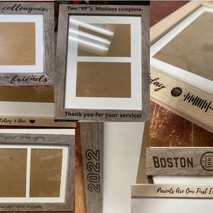 May include: Five different wood picture frames with various engravings. The frames are all in a light brown wood tone. The engravings include "Chance made us colleagues, but laughter made us friends", "Two "KP"s. Missions complete. Thank you for your service!", "Forever your little girls", "2022", and "BOSTON B BRUINS. Parents Are Our First Example of Love".