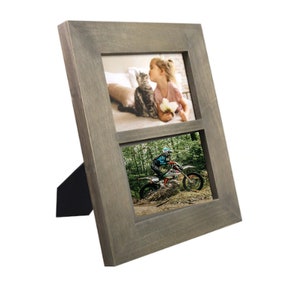 May include: A gray wooden picture frame with two openings for photos. The top opening shows a girl kissing a cat, and the bottom opening shows a person riding a dirt bike.