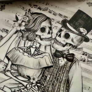 May include: Black and white illustration of a skeleton couple, the bride wearing a veil and flowers, the groom in a top hat and bow tie. The background features musical notes and floral accents, creating a romantic, yet gothic theme.