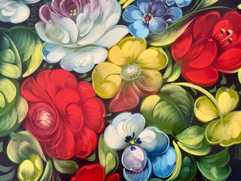 May include: Close-up of a floral painting featuring vibrant red, yellow, blue, and white flowers with green leaves against a dark background. The flowers are painted with detailed brushstrokes, creating a textured appearance.