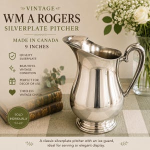 May include: A silverplate pitcher by WM A Rogers, measuring 9 inches in height. The pitcher features a polished metallic finish, a curved handle, a wide pouring spout with an integrated ice guard, and a circular base. The text reads VINTAGE WM A ROGERS SILVERPLATE PITCHER MADE IN CANADA 9 INCHES.