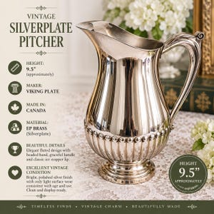 May include: A silverplate pitcher by Viking Plate, made in Canada, with a height of 9.5 inches. The pitcher features a polished silver finish, a fluted lower body, a beaded band, a curved handle, and an ice stopper lip on the pouring spout.