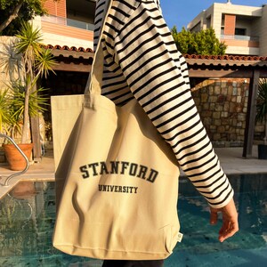 universite north/south foldable tote bag in canvas and smooth leather