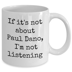 May include: White ceramic coffee mug with black text that reads "If it's not about Paul Dano, I'm not listening."