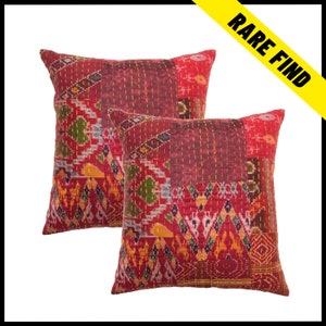 May include: Two square red decorative pillows with patchwork designs. The pillows feature a mix of patterns, including geometric shapes and floral motifs, with visible stitching. The pillows have a "Rare Find" banner in the upper right corner.