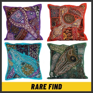 May include: Four decorative patchwork throw cushions in various colours. Each cushion has a unique design with embellishments, including purple, red, turquoise, and green. The cushions are square and have contrasting borders. The text "RARE FIND" is displayed in a yellow banner.