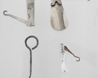 4 button hooks, 2 with patent days, one mother of pearl and silver shaft and a steel one
