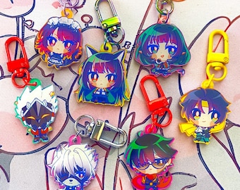 May include: A collection of colorful anime-style character keychains. Each keychain features a unique character design with vibrant colors, attached to a metal clasp. The keychains are in various shapes and sizes, showcasing a variety of anime-inspired aesthetics.