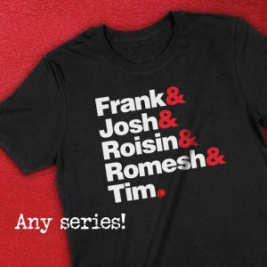 May include: Black t-shirt with white text that reads "Frank & Josh & Roisin & Romesh & Tim." The text is in a bold, sans-serif font. The shirt has a red circle with a white dot in the center.