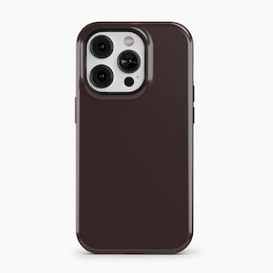 May include: A dark brown smartphone case with a glossy finish. The case has a camera module with three lenses and a flash. The case is designed to protect the phone from scratches and impacts.