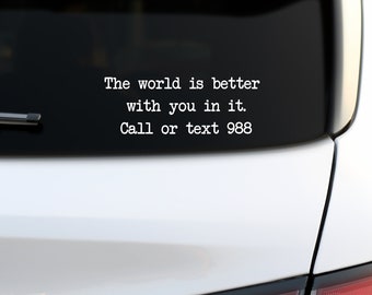 May include: White car with a black bumper sticker that reads "The world is better with you in it. Call or text 988"