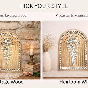 May include: Wooden wall art in two styles: Heritage Wood and Heirloom White. Each features a layered wood design with an arched top and a floral motif. The text "Pick Your Style" is at the top, with checkmarks indicating layered wood and rustic styles.