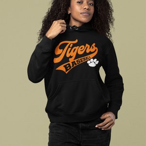 May include: Black hooded sweatshirt with an orange graphic that says "Tigers Baseball" with a white paw print.