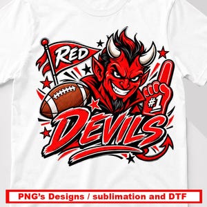 May include: A white t-shirt featuring a graphic of a red devil character with horns, a brown football, a red flag with the text RED, and a red foam finger with the text #1. The word DEVILS is printed in large red letters below the character.