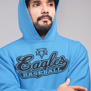 May include: A blue hooded sweatshirt with a black and white graphic of an eagle and the text "Eagles Baseball".