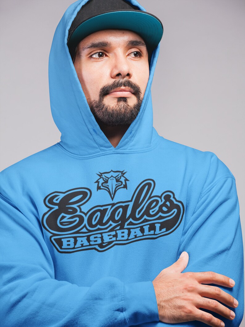 May include: A blue hooded sweatshirt with a black and white graphic of an eagle and the text "Eagles Baseball".