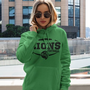 May include: Green hooded sweatshirt with a black lion graphic and the text "Lions Football".