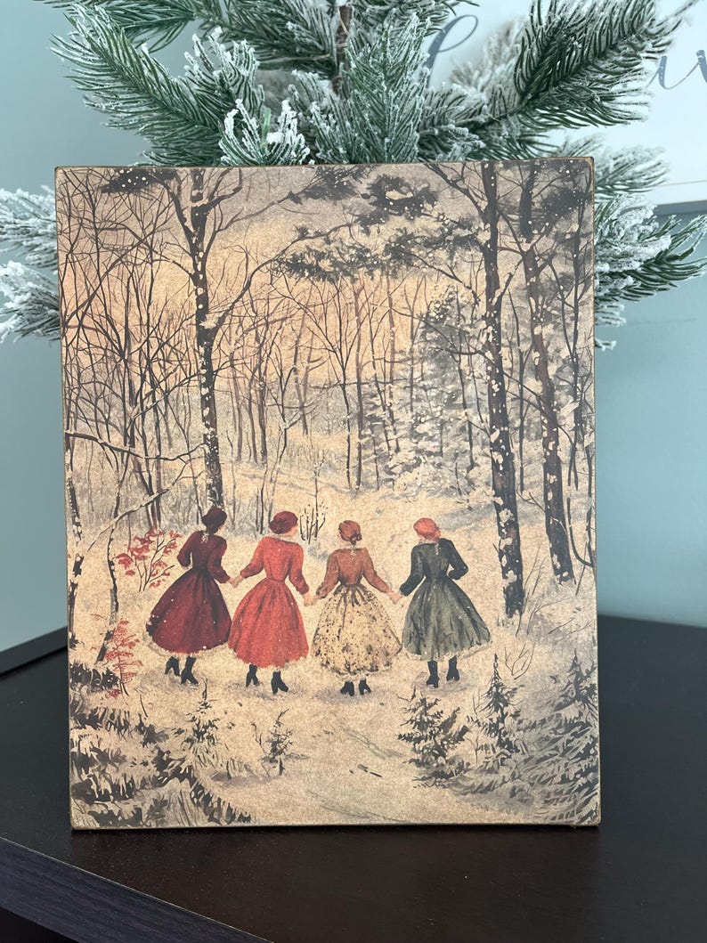 May include: Four women in vintage dresses walk hand-in-hand through a snowy forest. The women are wearing red, green, and cream dresses. The forest is depicted in shades of brown and white.
