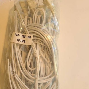 May include: A package of 10 white electrical extension cords with three-prong plugs. The package is labeled "113-125-04 10 PCS".
