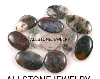 May include: A selection of polished moss agate gemstones in diverse shapes, such as oval, teardrop, and round. The stones exhibit a blend of green, brown, and white patterns. The text "ALLSTONEJEWELRY" is visible at the bottom.