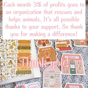 May include: A collection of colorful stickers featuring illustrations of bookstores, libraries, and book cafes. The stickers have a whimsical and charming aesthetic, with details like bookshelves, windows, and signs. The text "Thank you!" is written in large, pink letters on the image.