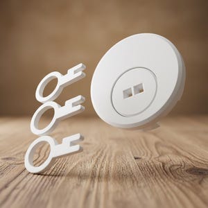 May include: A white, circular object with a keyhole design and three white keys floating above a wooden surface. The keys are simple in design, and the background is a blurred brown.