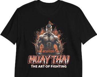 May include: Black t-shirt with an illustration of a muscular man in a Muay Thai fighting stance. The text "Muay Thai" and "The Art of Fighting" is printed in orange below the illustration.