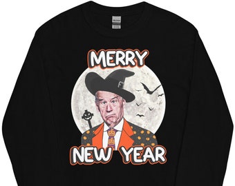 May include: Black long-sleeved t-shirt featuring a graphic of a man wearing a witch's hat and the text "Merry New Year".